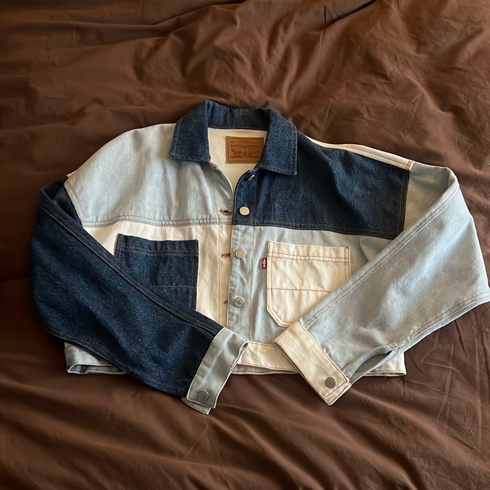 Patchwork Levi’s denim trucker jacket. Fits like an oversized medium.